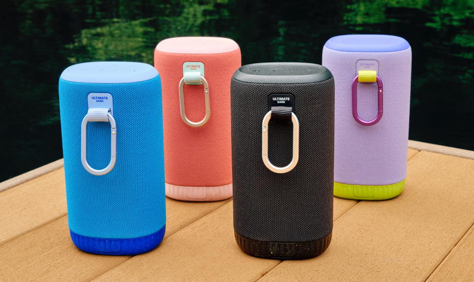 Ultimate Ears Everboom speakers in several colours with carabiner clips.