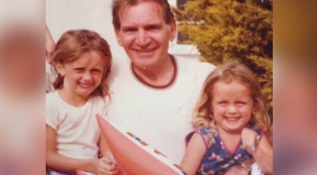 Ms Carr and her sister Lizzy were both aged under five (pictured with their grandfather) when the fire ripped through the house. Photo: Supplied