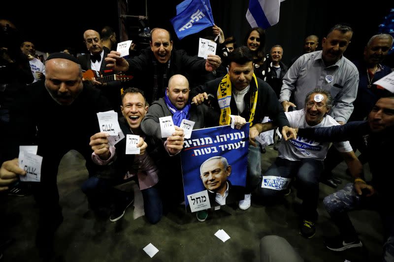 Supporters react as results of the exit polls in Israel's elections are announced at Israeli Prime Ministers Benjamin Netanyahu's Likud party headquarters in Tel Aviv