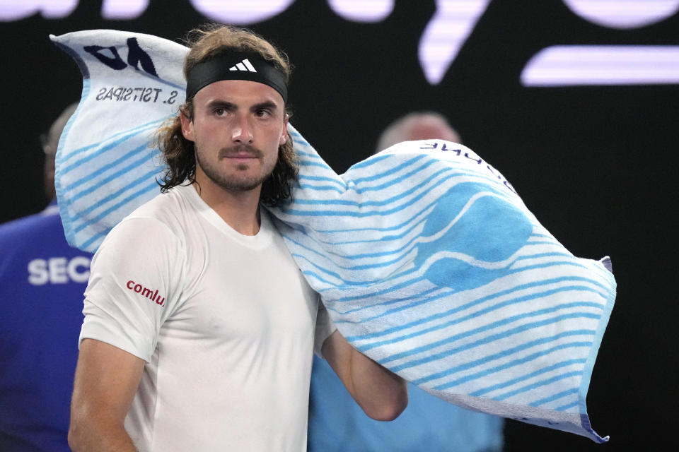 Stefanos Tsitsipas of Greece reacts as he changes ends during his men's singles final match against Novak Djokovic of Serbia at the Australian Open tennis championship in Melbourne, Australia, Sunday, Jan. 29, 2023. (AP Photo/Dita Alangkara)