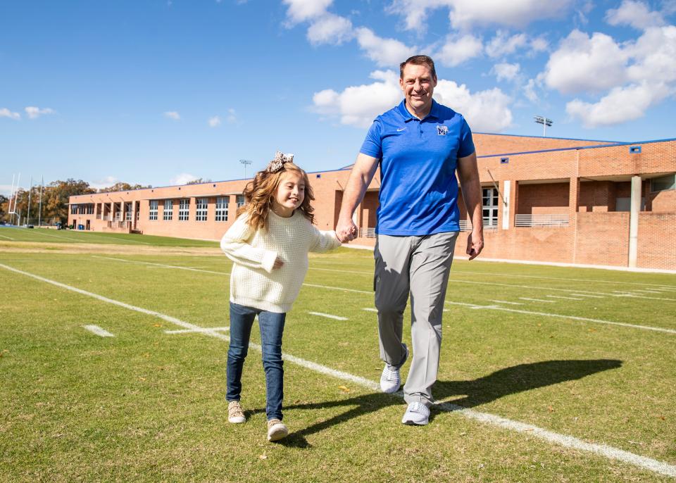 Memphis senior offensive consultant Joshua Eargle and his daughter Landrey, who is battling a rare genetic condition Wednesday, Nov. 17, 2021.