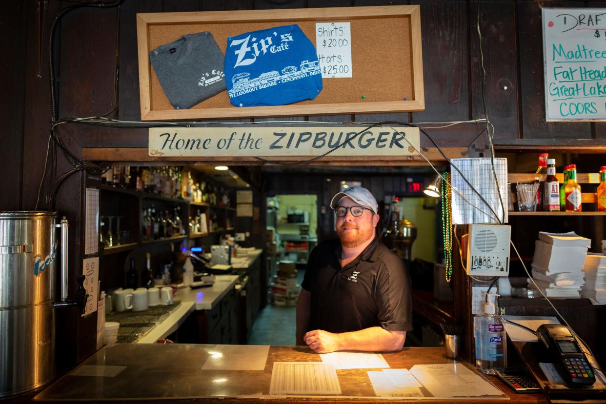 Owner Mike Burke stands behind the service counter at Zip's Cafe, in Mount Lookout.