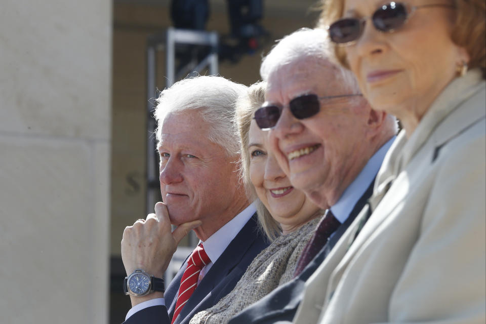 From left, former President Bill Clinton, his wife, former first lady and former Secretary of State Hillary Rodham Clinton, former President Jimmy Carter, and his wife, former first lady Rosalynn Carter listen during the dedication of the George W. Bush presidential library on the campus of Southern Methodist University in Dallas, Thursday, April 25, 2013. (AP Photo/Charles Dharapak)