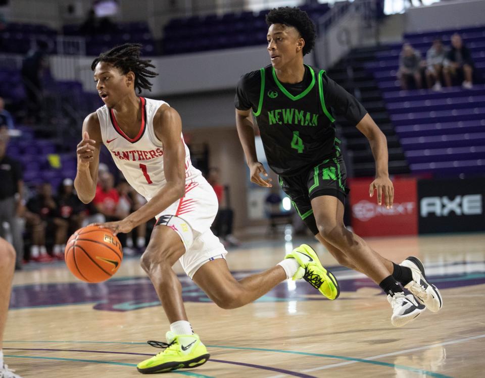 Rahmir Barno of Imhotep Charter drives to the basket against Isidore Newman in the City of Palms Classic on Saturday, Dec. 17, 2022, at Suncoast Credit Union Arena in Fort Myers.