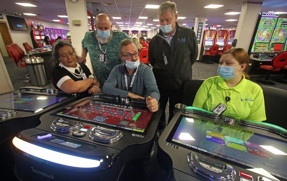 Casino workers train on the Interblock electronic gaming tables inside the newest expansion facility at Catawba Two Kings Casino in Kings Mountain Tuesday morning, Dec. 14, 2021.