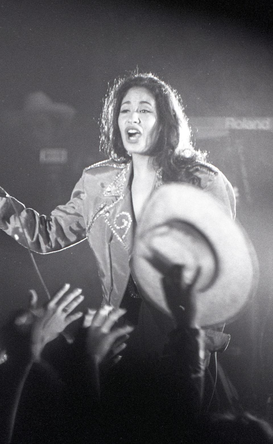 Singer Selena Quintanilla-Perez performs during the recording of her LP "Selena Live" at a free concert held at Memorial Coliseum Feb. 7, 1993.