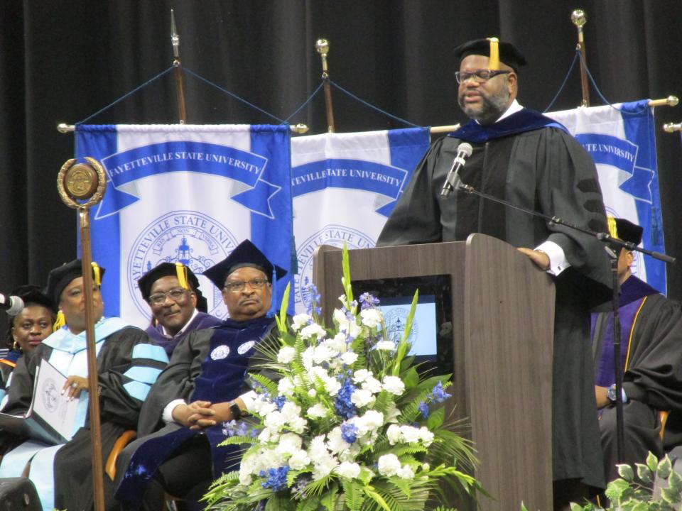Nicholas Perkins, an E.E. Smith High School and Fayetteville State University graduate, addresses the FSU class of 2022 at Crown Coliseum.