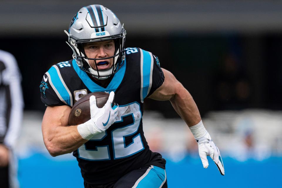 FILE - Carolina Panthers running back Christian McCaffrey (22) runs with the ball against the Washington Football Team during an NFL football game Sunday, Nov. 21, 2021, in Charlotte, N.C. The Panthers are hoping McCaffrey can bounce back from two injury-plagued seasons and return to his 2019 form when he became only the third player in NFL history to surpass 1,000 yards rushing and 1,000 yards receiving in a season.(AP Photo/Jacob Kupferman, File)