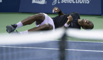 Gael Monfils, of France, lies on the court in pain following an injury during his match against Jack Draper, of Britain, during the National Bank Open tennis tournament Thursday, Aug. 11, 2022, in Montreal. (Paul Chiasson/The Canadian Press via AP)