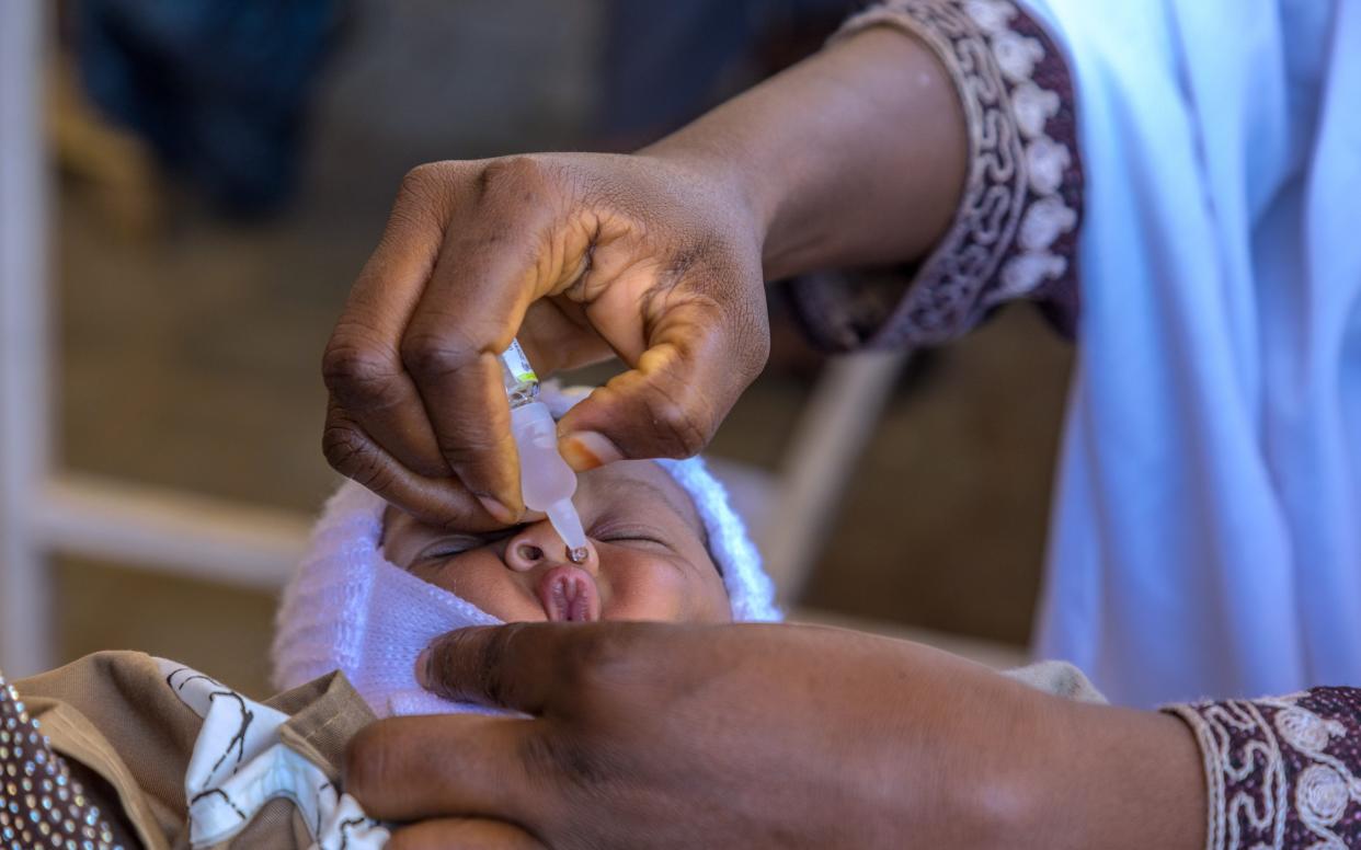 A baby receives a polio vaccination in Kano State, Nigeria  - Andrew Esiebo