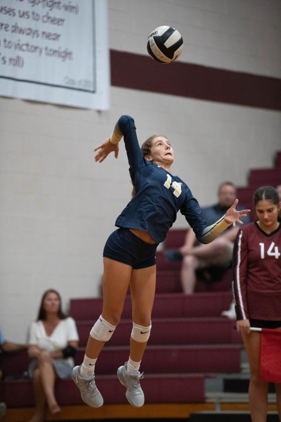 Bella Ciolino (14) plays the ball during the Gulf Breeze vs Navarre volleyball match at Navarre High School on Tuesday, Sept. 12, 2023.