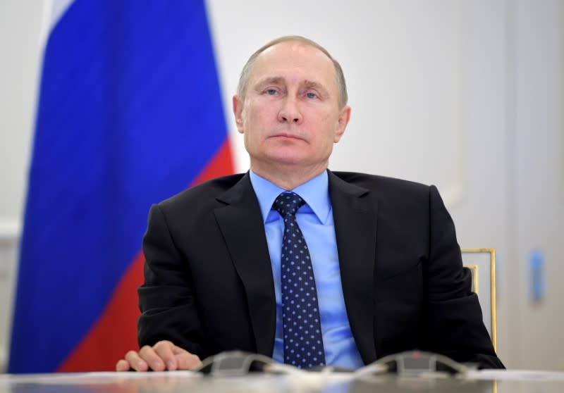 FILE PHOTO: Russian President Putin takes part in a video link in Moscow