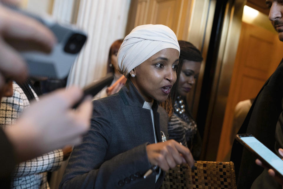 Rep. Ilhan Omar, D-Minn., talks to reporters as she leaves the House chamber at the Capitol in Washington, Thursday, Feb. 2, 2023. House Republicans have voted to oust Omar from the House Foreign Affairs Committee. The vote in a raucous session on Thursday to remove the Somali-born Muslim lawmaker came after her past comments critical of Israel. (AP Photo/Jose Luis Magana)
