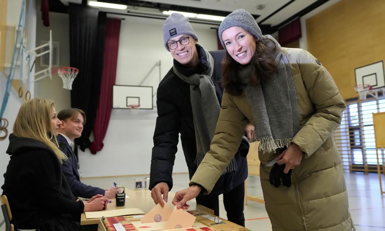 <span>Alexander Stubb and his British-Finnish wife, Suzanne Innes-Stubb, cast their votes in Espoo.</span><span>Photograph: Sergei Grits/AP</span>