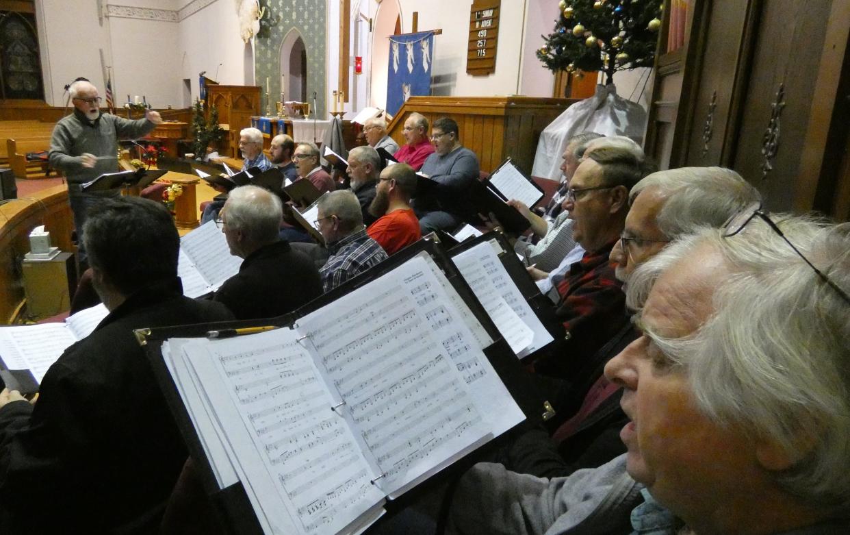 Director George Gibbs, left, leads a rehearsal of United in Harmony on Monday at Good Hope Lutheran Church.