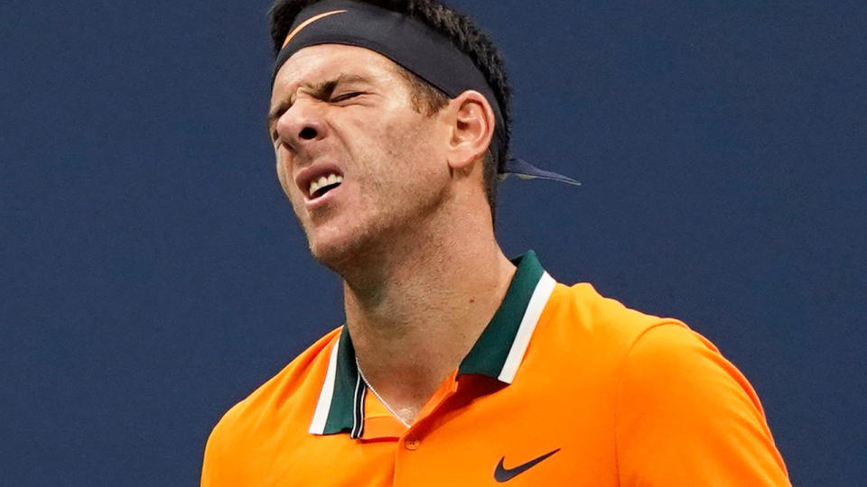 Juan Martin del Potro reacts to a point while playing Novak Djokovic. (Photo by Eduardo MUNOZ ALVAREZ / AFP)