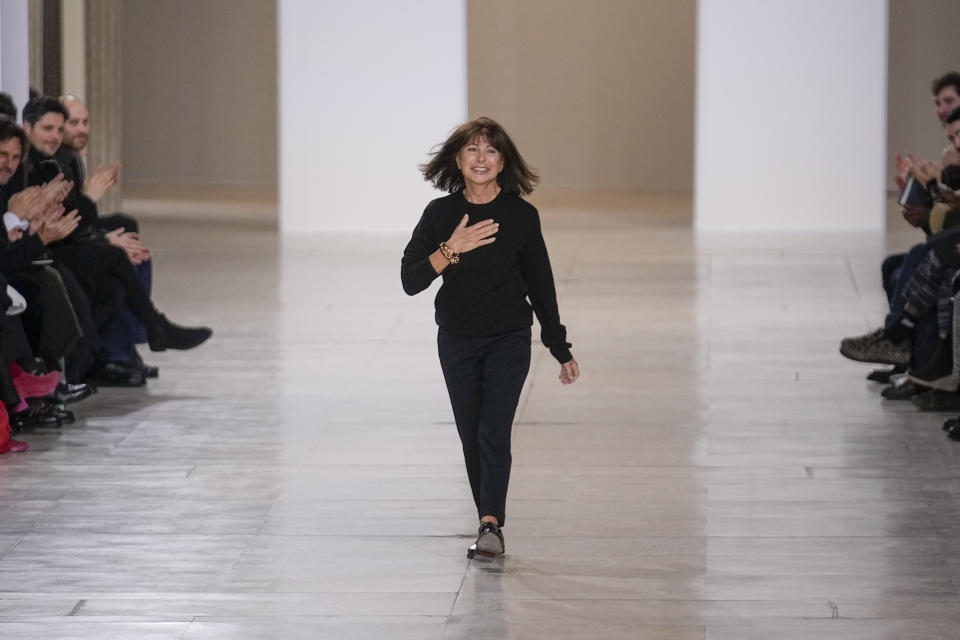 Designer Veronique Nichanian accepts applause for Hermes as part of the Menswear ready-to-wear Fall-Winter 2024-2025 collection presented in Paris, Saturday, Jan. 20, 2024. (AP Photo/Michel Euler)