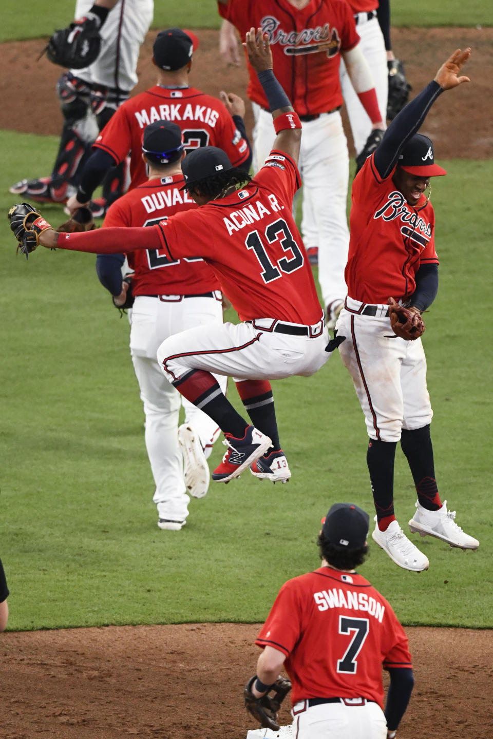 Atlanta Braves center fielder Ronald Acuna Jr. (13), celebrates with Atlanta Braves second baseman Ozzie Albies (1) after Game 2 of a best-of-five National League Division Series against the St. Louis Cardinals, Friday, Oct. 4, 2019, in Atlanta. The Atlanta Braves won 3-0. (AP Photo/Scott Cunningham)