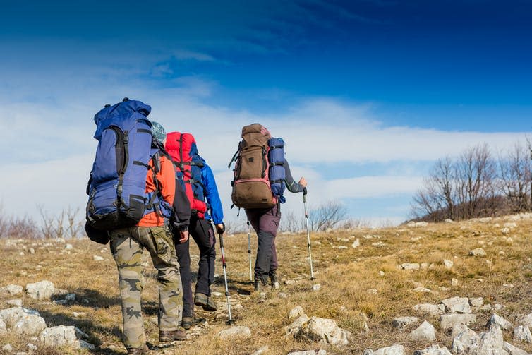 Hikers on a hill.