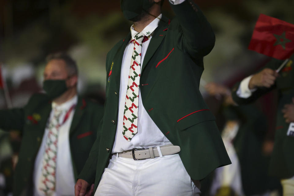 A member from Team Morocco arrives during the opening ceremony in the Olympic Stadium at the 2020 Summer Olympics, Friday, July 23, 2021, in Tokyo, Japan. (Hannah McKay/Pool Photo via AP)