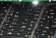 Fans watch during the fifth inning in Game 1 of the baseball World Series between the Los Angeles Dodgers and the Tampa Bay Rays Tuesday, Oct. 20, 2020, in Arlington, Texas. (AP Photo/David J. Phillip)