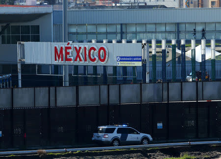 A U.S. border patrol vehicle drives along the border wall between Mexico and the United States in San Ysidro, California, U.S., January 25, 2017. REUTERS/Mike Blake