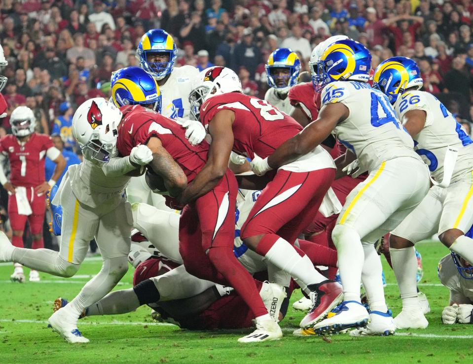 Will the Arizona Cardinals beat the Los Angeles Rams on Monday night? Our writers are pretty split on the outcome of the final NFL playoff wild-card game.