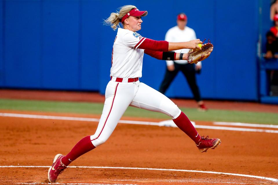 Florida State utility Mack Leonard (13) pitches in the first inning during the first game of the Women's College World Series finals between Oklahoma (OU) and Florida State at USA Softball Hall of Fame Stadium in Oklahoma City on Wednesday, June 7, 2023.