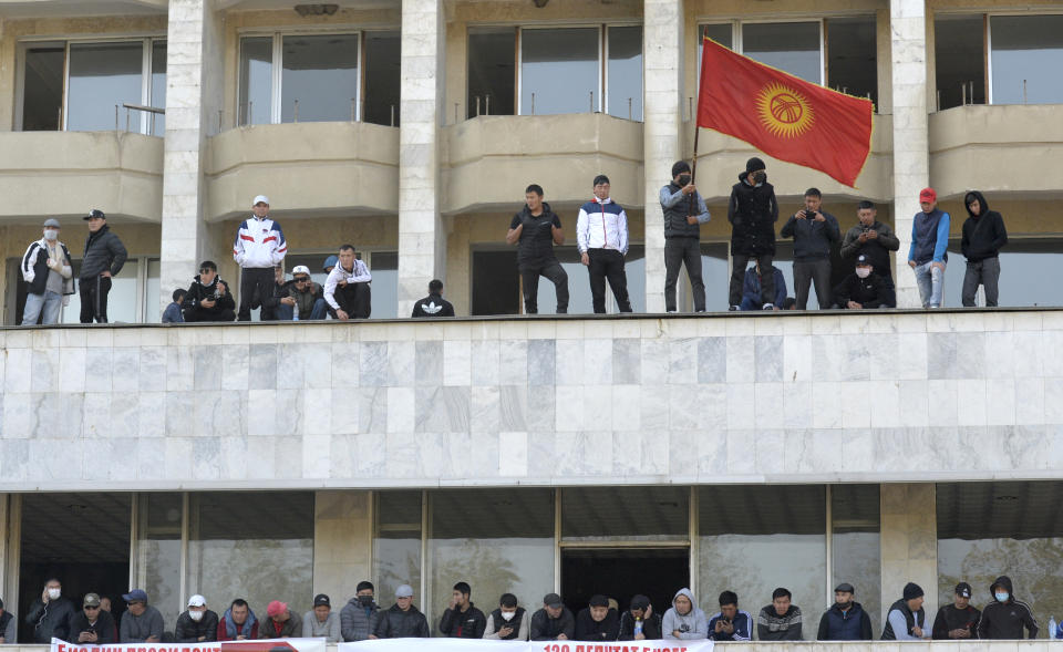 Supporters of Kyrgyzstan's Prime Minister Sadyr Japarov attend a rally in Bishkek, Kyrgyzstan, Thursday, Oct. 15, 2020. Kyrgyzstan President Sooronbai Jeenbekov announced his resignation on Thursday in a bid to end the turmoil that has engulfed the Central Asian nation after a disputed parliamentary election. (AP Photo/Vladimir Voronin)