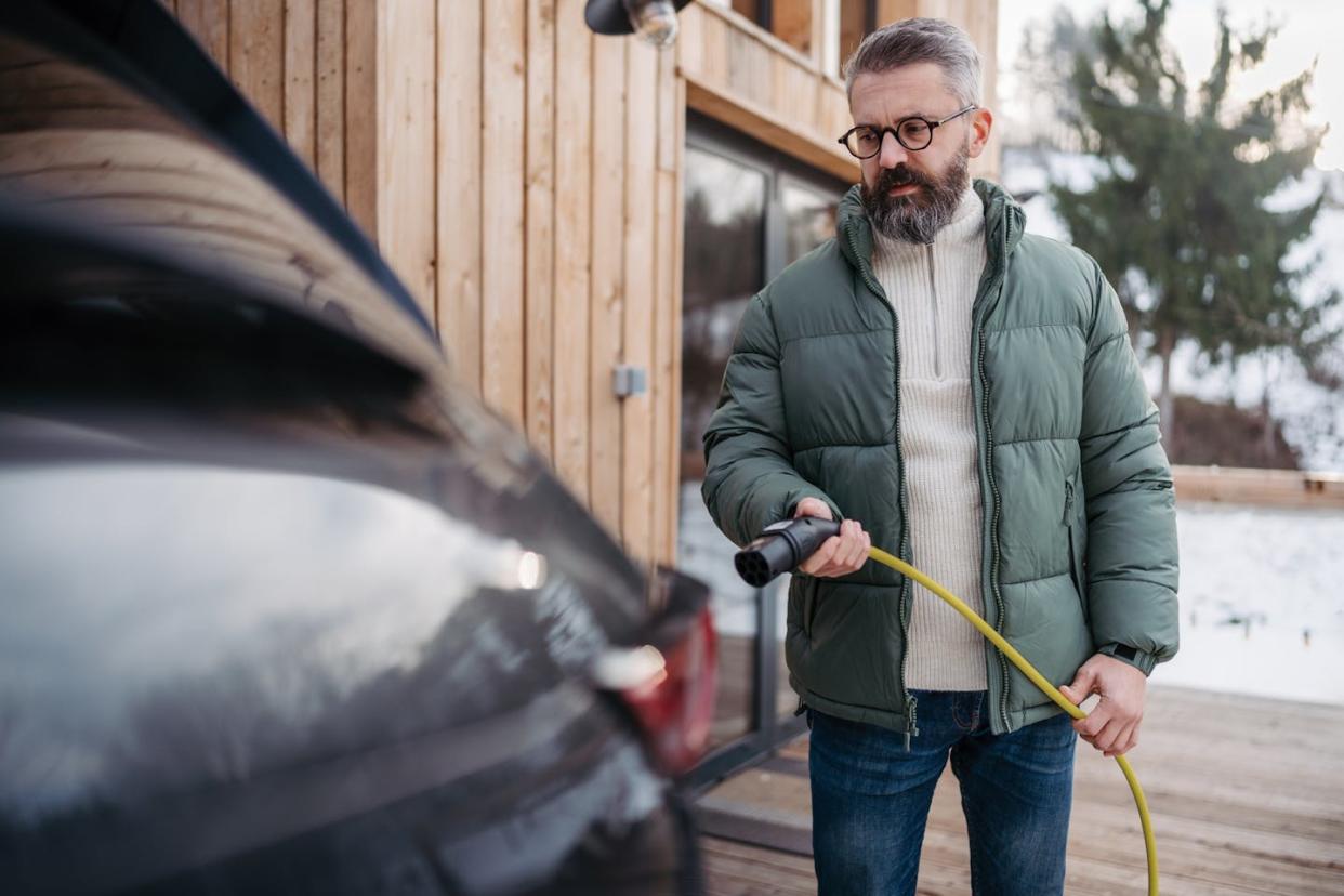 Why do batteries lose charge more quickly when it's cold? <a href="https://www.gettyimages.com/detail/photo/man-charging-electric-car-in-front-his-cabin-in-royalty-free-image/1977511649?phrase=battery+cold&adppopup=true" rel="nofollow noopener" target="_blank" data-ylk="slk:Halfpoint Images/Moment;elm:context_link;itc:0;sec:content-canvas" class="link ">Halfpoint Images/Moment</a>