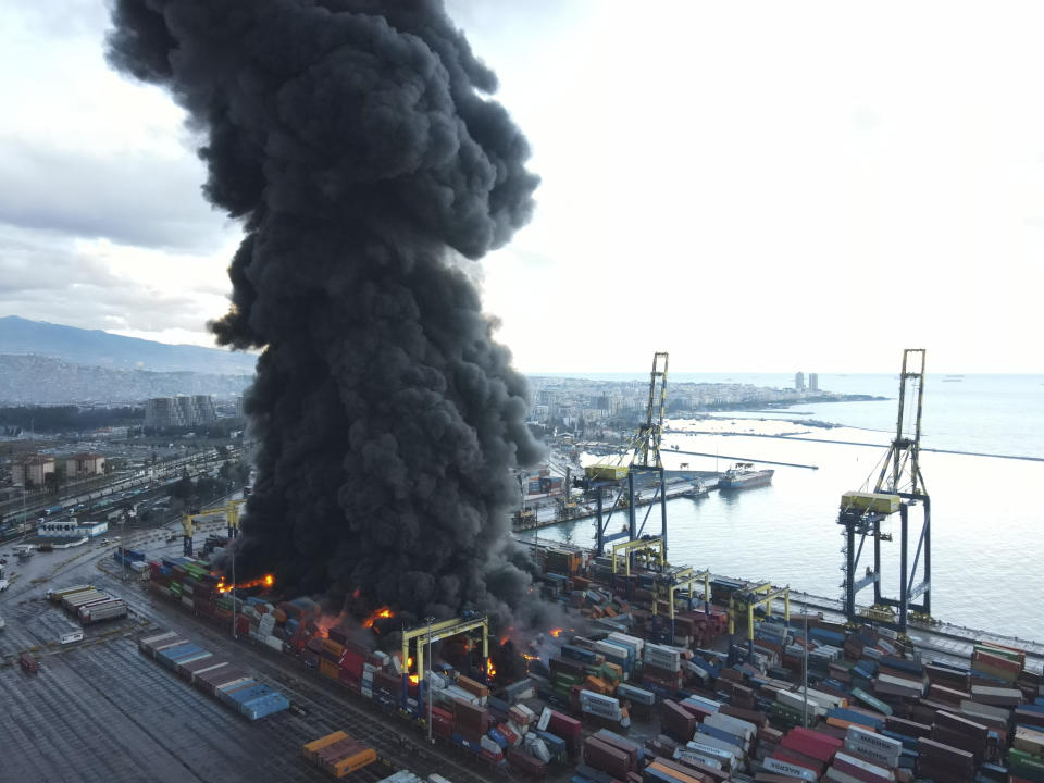 <p>Smoke rises from burning containers at the port in the earthquake-stricken town of Iskenderun, southern Turkey, Tuesday, Feb. 7, 2023. Television images on Tuesday showed thick black smoke rising from burning containers at Iskenderun Port. Reports said the fire was caused by containers that toppled over during the powerful earthquake that struck southeast Turkey on Monday. Turkey's state-run Anadolu Agency said a Turkish Coast Guard vessel was assisting efforts to extinguish fire. (Serdar Ozsoy/Depo Photos via AP)</p> 