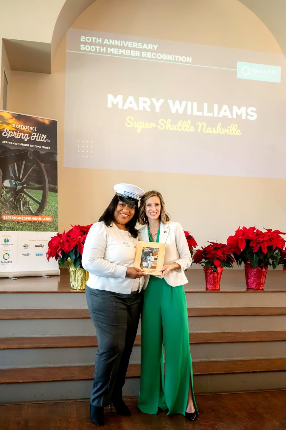 Executive Director Becca Melton presents Mary Williams of Super Shuttle Nashville with a special recognition plaque for becoming the 500th member of the Spring Hill Chamber earlier this year at the Annual State of the Chamber and Awards Ceremony on Dec. 7, 2023.