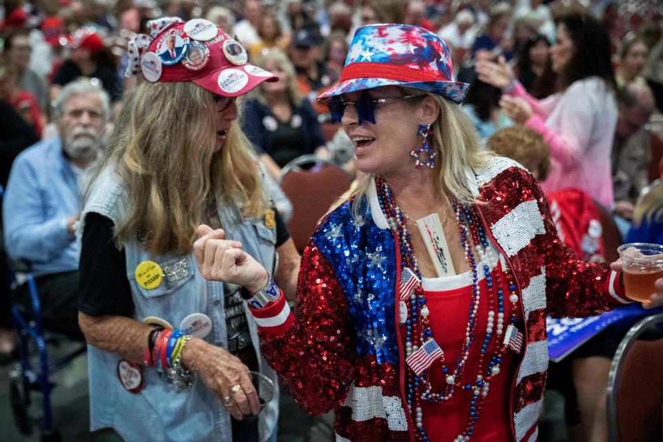 Mary Kelley, left, and Renee Korabiak attend a speech by former President Donald Trump at the Palm Beach County Convention Center on Oct. 11.