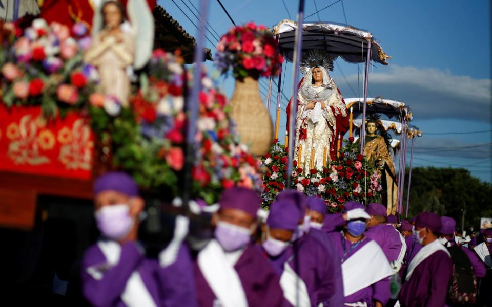 Members of the Brotherhood of El Jesus Nazareno take part at Los Cristos procession during the Holy Week celebration, as the coronavirus outbreak continues - REUTERS/Jose Cabezas