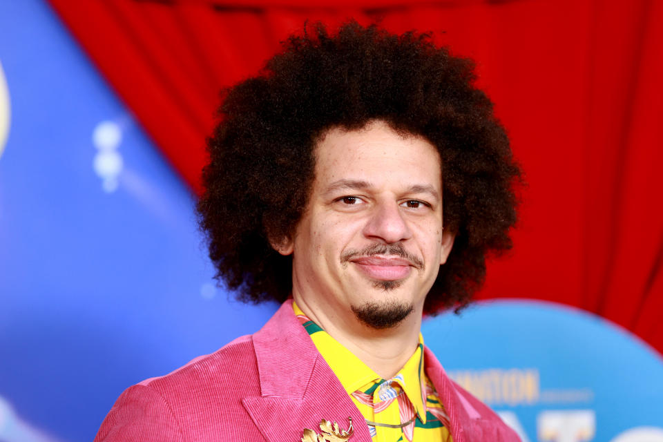 Eric André wearing pink suit.