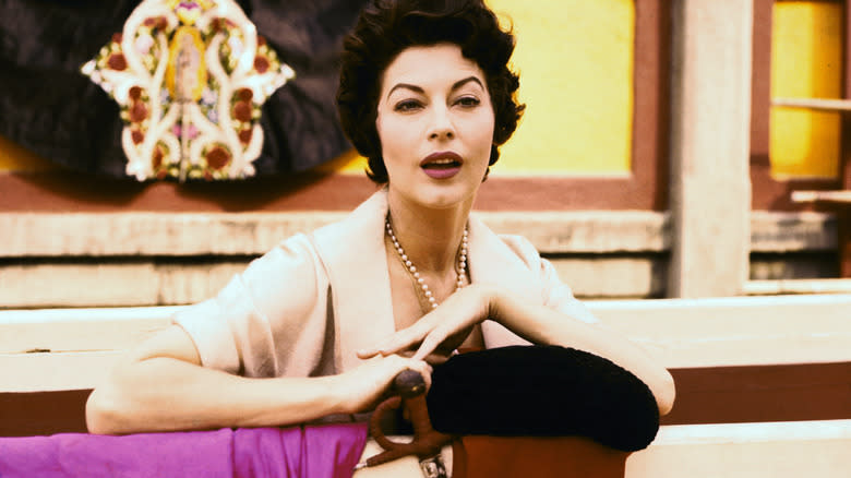 Ava Gardner leaning by sword