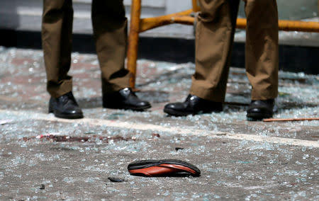 A shoe of a victim is seen in front of the St. Anthony’s Shrine, Kochchikade church after an explosion in Colombo, Sri Lanka April 21, 2019. REUTERS/Dinuka Liyanawatte.
