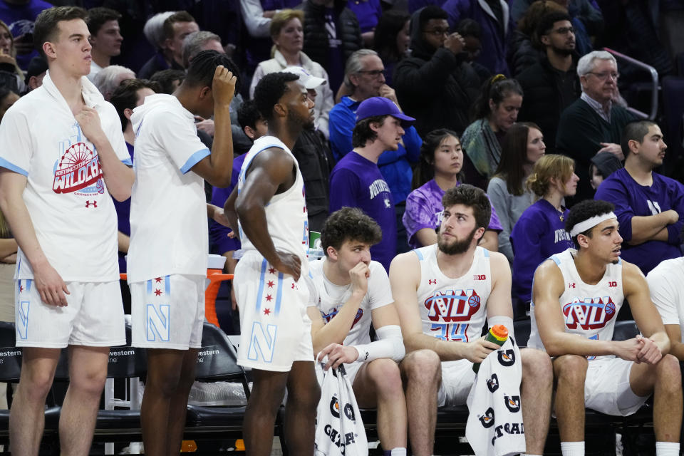 Northwestern players watch during overtime of the team's NCAA college basketball game against Penn State in Evanston, Ill., Wednesday, March 1, 2023. Penn State won 68-65. (AP Photo/Nam Y. Huh)