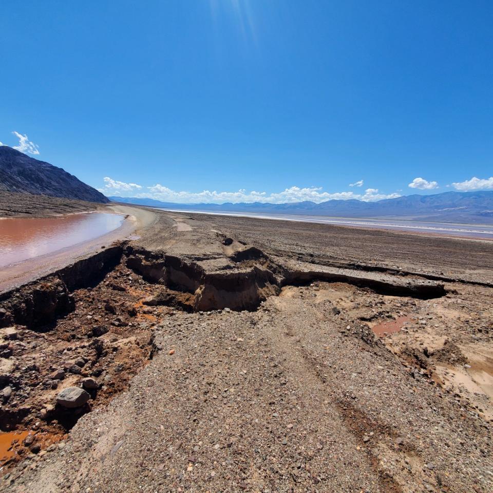 Standing water and road damage on Badwater Road. (NPS photo)