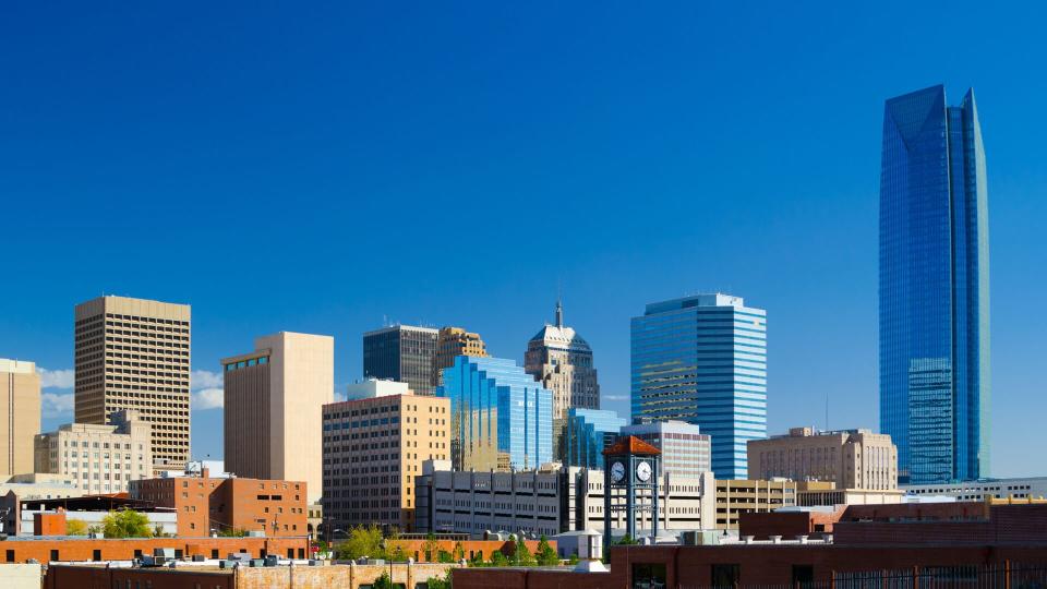 Oklahoma downtown skyline with a deep blue sky, featuring the new Devon Energy Center building.