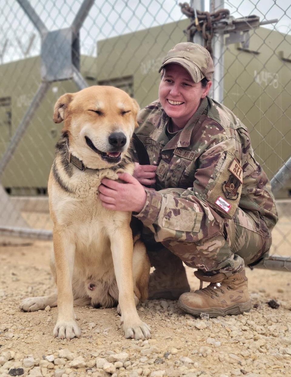 Air Force Sgt Working to Rescue dog