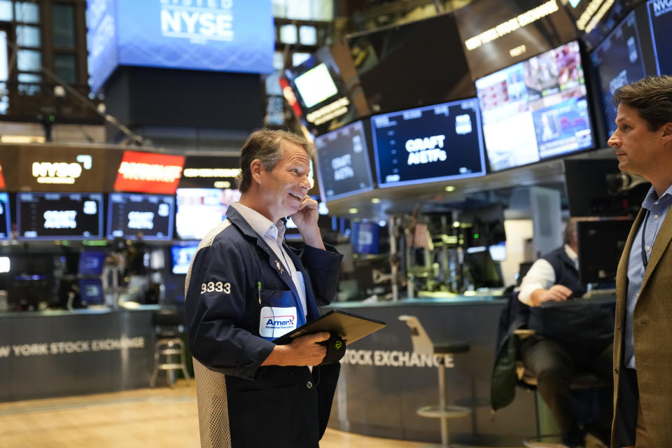 Traders work on the floor at the New York Stock Exchange in New York, Monday, Nov. 28, 2022. (AP Photo/Seth Wenig)