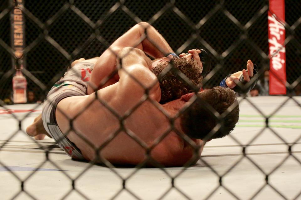 Demian Maia gets Ben Askren in a rear neck choke that forces Askren to tap out at the UFC Fight Night event at Singapore Indoor Stadium. (PHOTO: Dhany Osman/Yahoo News Singapore)