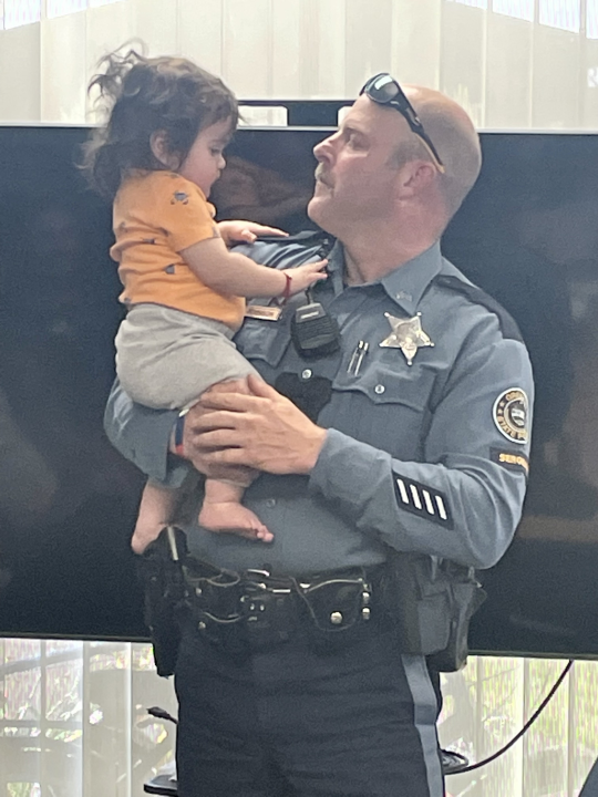 Oregon State Police Sgt. OJ Johnson holds Roman Santos. April 24, 2024 (courtesy Oregon State Police). 