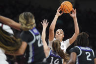 South Carolina center Kamilla Cardoso (10) passes the ball over Kansas State guard Rebekah Dallinger (14) during the second half of an NCAA college basketball game Friday, Dec. 3, 2021, in Columbia, S.C. (AP Photo/Sean Rayford)