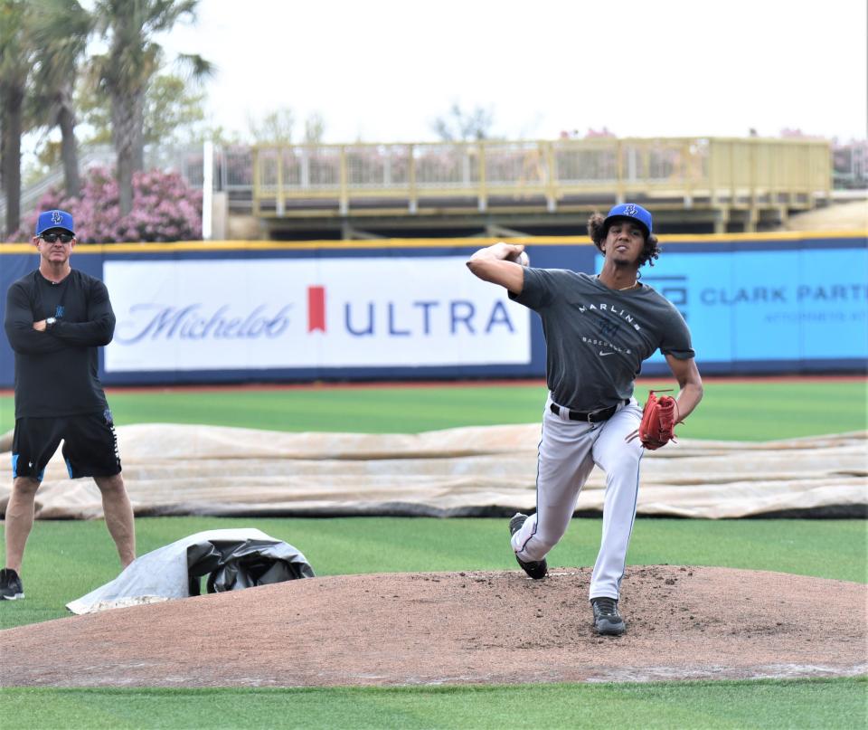 Blue Wahoos 18-year-old touted pitcher Eury Perez goes through a workout Tuesday at Blue Wahoos stadium as pitching coach Dave Eiland looks on.