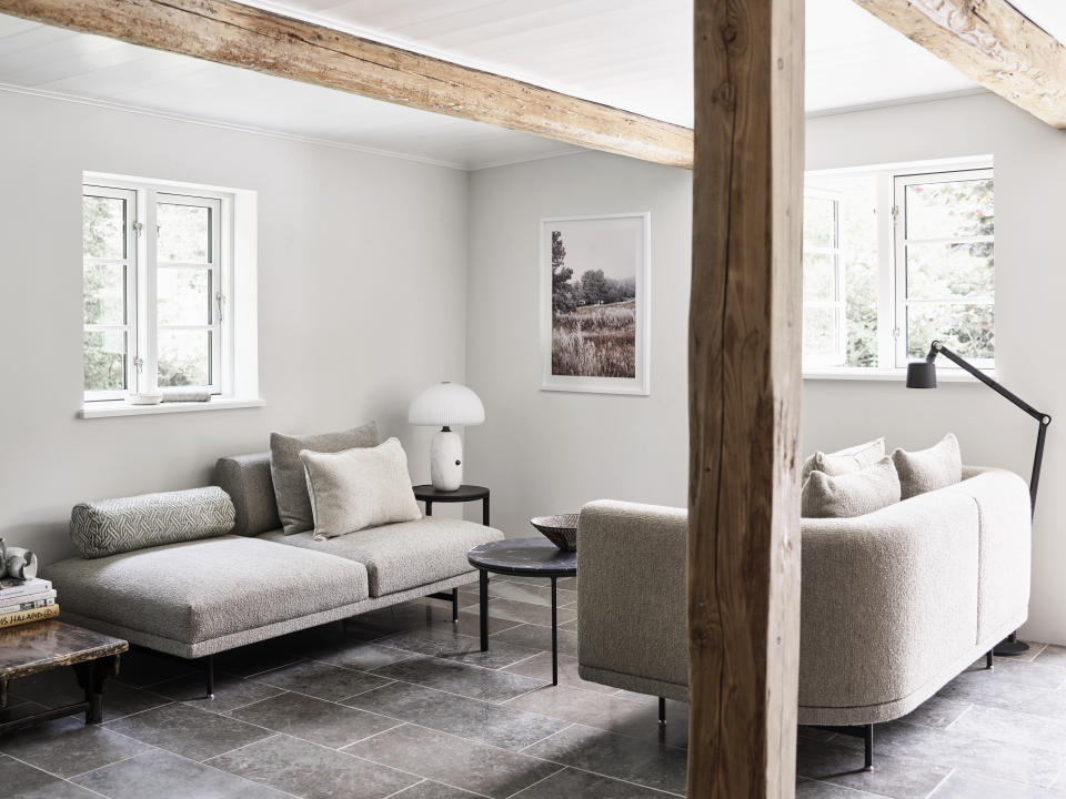 <p> &#x2018;Wood detailing is synonymous with farmhouse living rooms, so wood beams and panelling immediately evoke a more country look,&#x2019; says Heather Hilliard, Founder of Heather Hilliard Design.&#xA0; </p> <p> &#x2018;To make them a little more modern, paint the entire room, including any wood columns, white. It will immediately give it a clean lift and more contemporary, gallery like, feel.&#x2019; </p> <p> The designer of this space, Julie Cloos M&#xF8;lsgaard, chose neutral tones to add a sense of serenity, and added tactile textures for vibrancy and movement.&#xA0; </p>