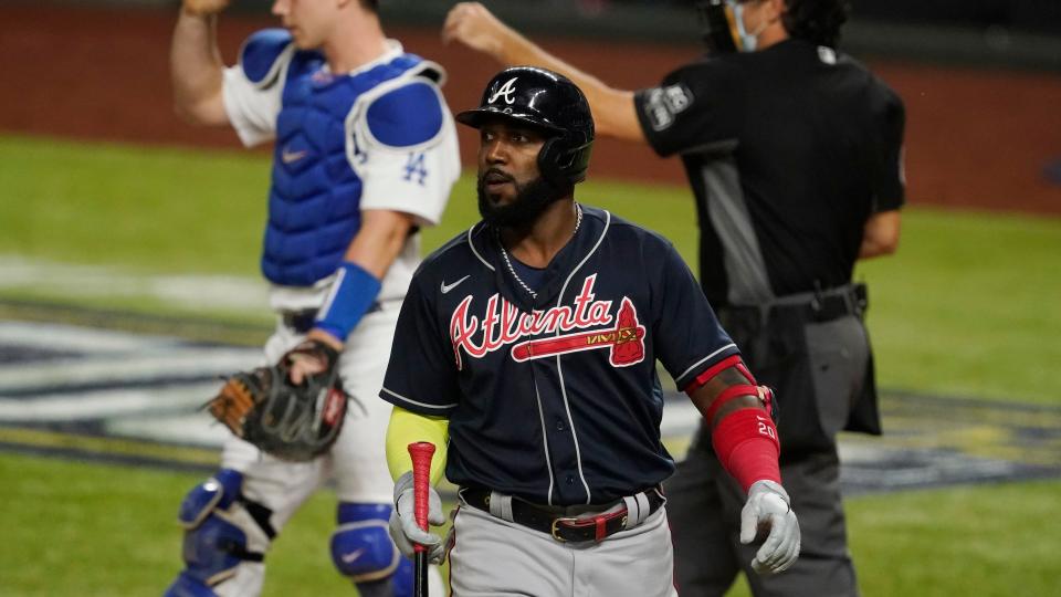 Mandatory Credit: Photo by Tony Gutierrez/AP/Shutterstock (10964348cy)Atlanta Braves' Marcell Ozuna walks to the dugout after striking out during the sixth inning in Game 7 of a baseball National League Championship Series against the Los Angeles Dodgers, in Arlington, TexasNLCS Braves Dodgers Baseball, Arlington, United States - 18 Oct 2020.