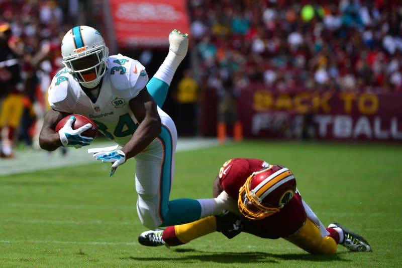 Running back Damien Williams (L) started his NFL career with the Miami Dolphins. File Photo by Kevin Dietsch/UPI