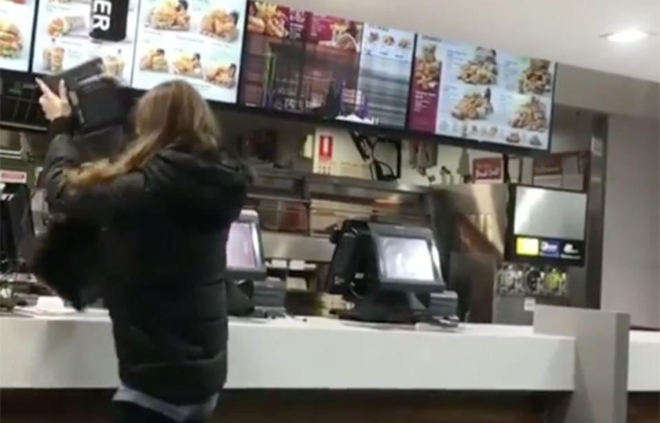 A 20 year old woman has been charged after outrageous footage surfaced of her appearing to rage out at employees and throw EFTPOS machines at staff at an Adelaide KFC. Source: yeahceebs / Instagram